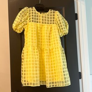Fun yellow baby doll dress.  Bright and great for summer fun! New with tag